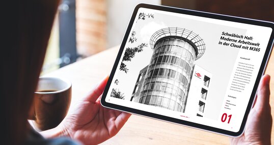 Mockup image of a woman holding digital tablet with blank white desktop screen in cafe