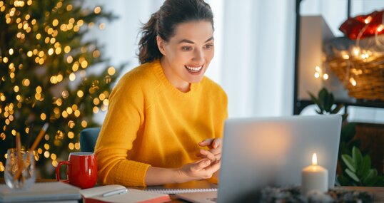 Woman working in home office before Christmas